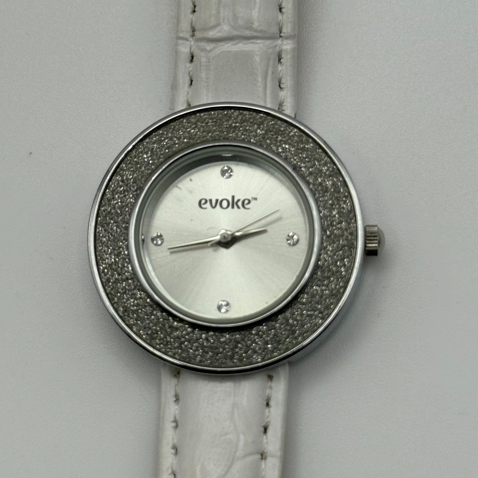 Evoke Ladies Quartz Watch Silver Dial Glitter Bezel White Strap Working 30mm