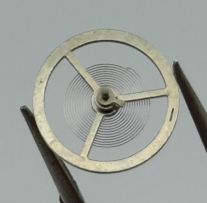 BFG 866 Balance Wheel Complete And Spring  DGT.  64 Watch Movement Parts NOS