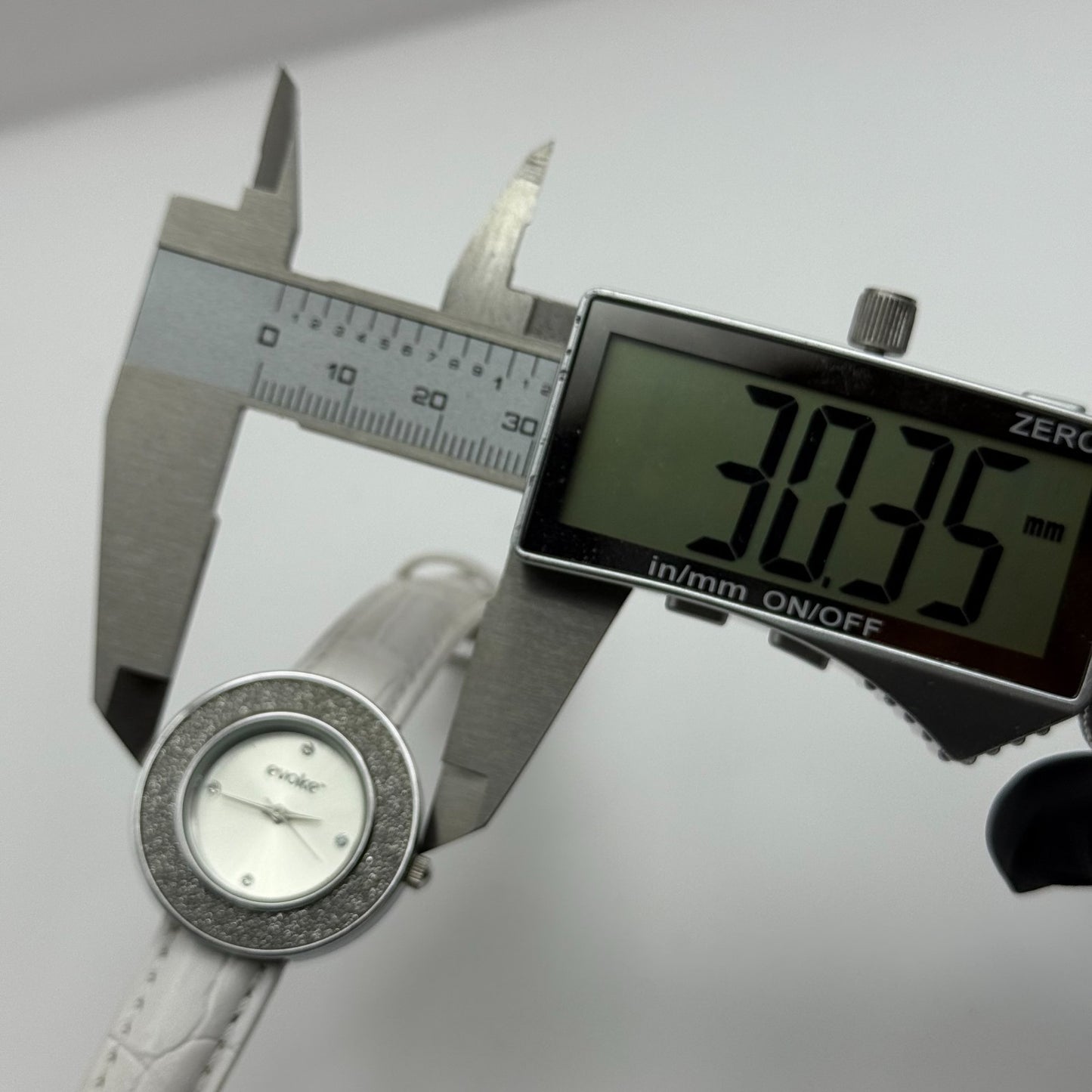 Evoke Ladies Quartz Watch Silver Dial Glitter Bezel White Strap Working 30mm