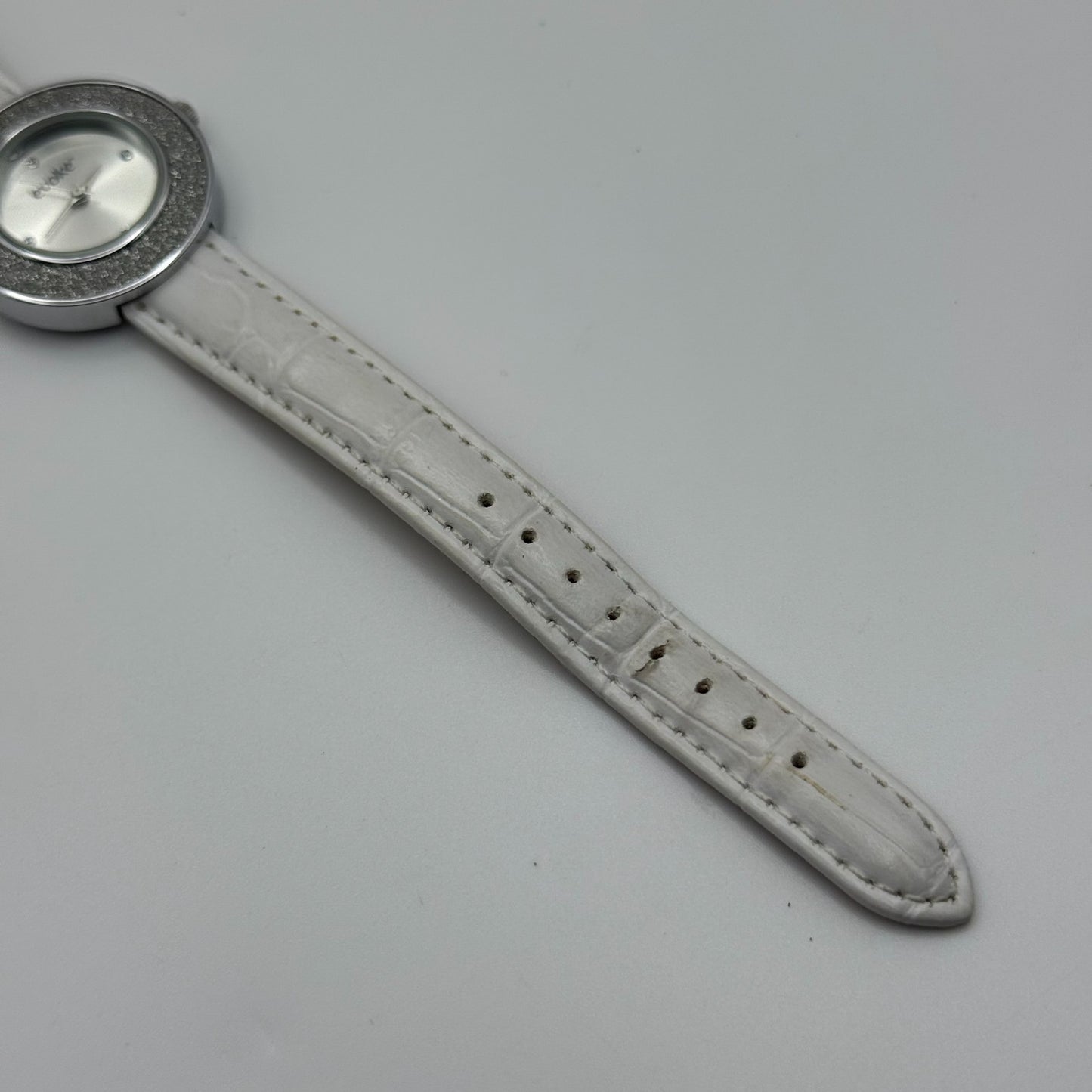 Evoke Ladies Quartz Watch Silver Dial Glitter Bezel White Strap Working 30mm