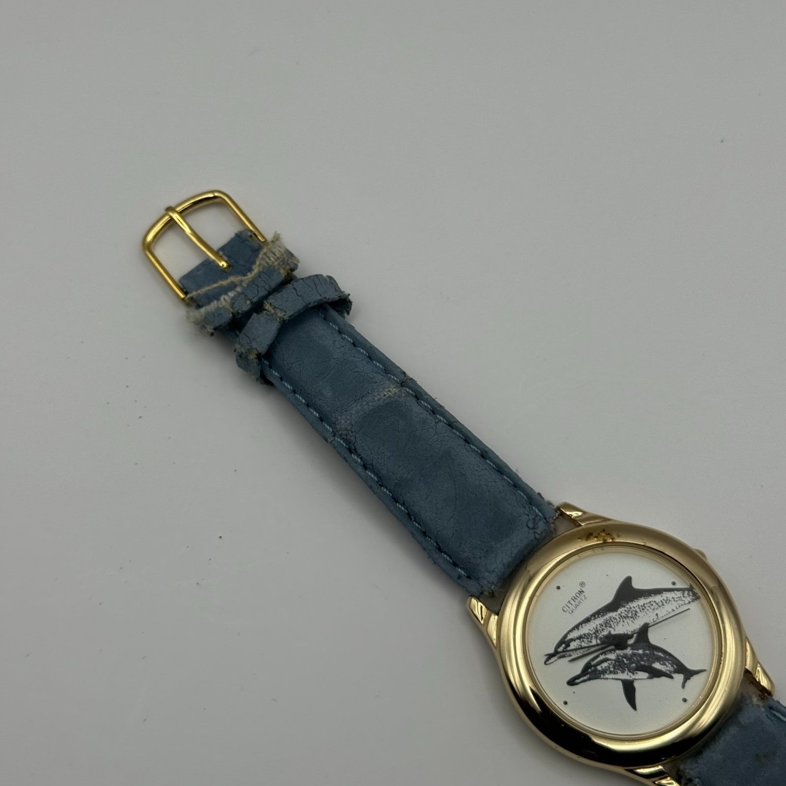 Citron Ladies Quartz Watch Dolphin Dial Gold Tone Blue Strap Working 35mm