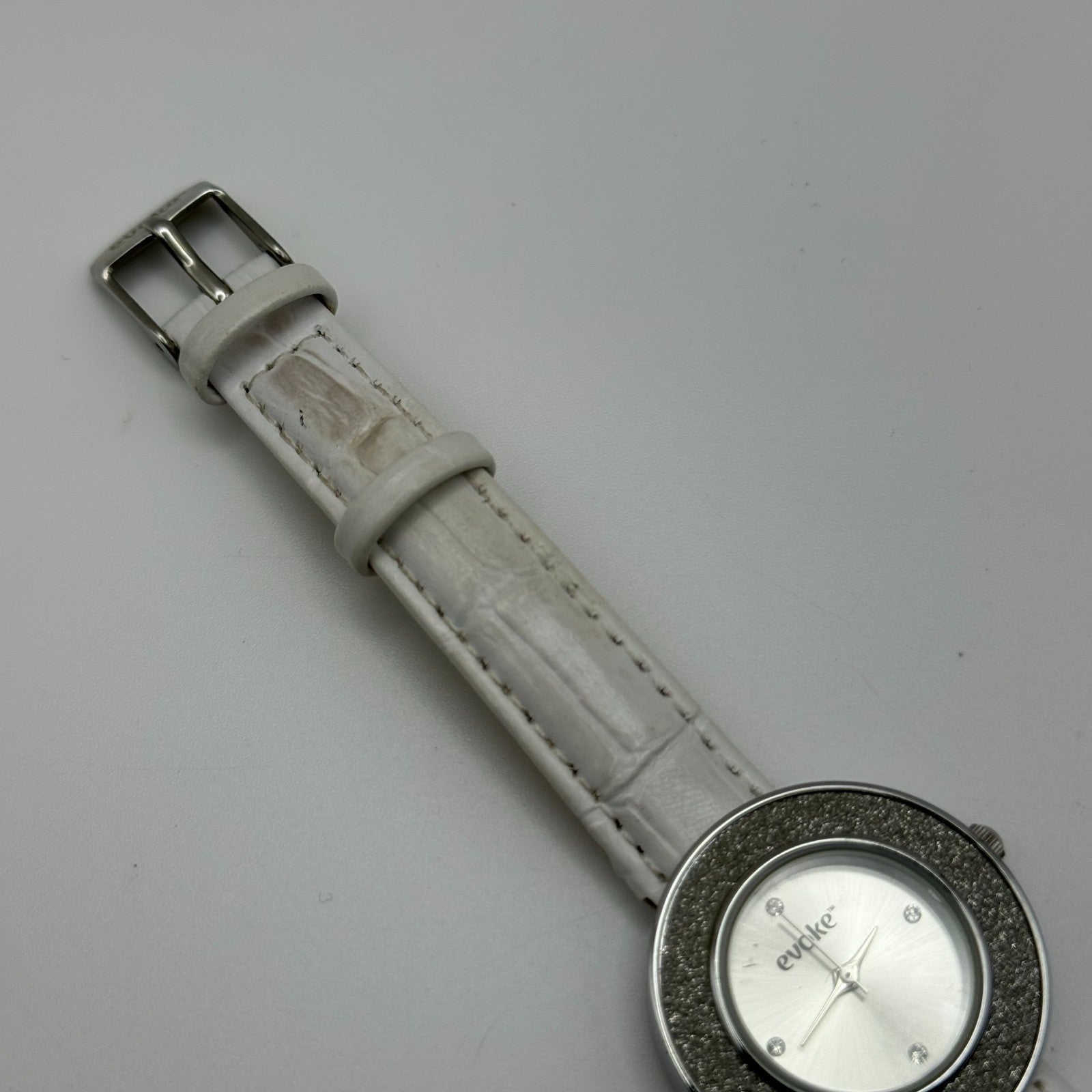 Evoke Ladies Quartz Watch Silver Dial Glitter Bezel White Strap Working 30mm