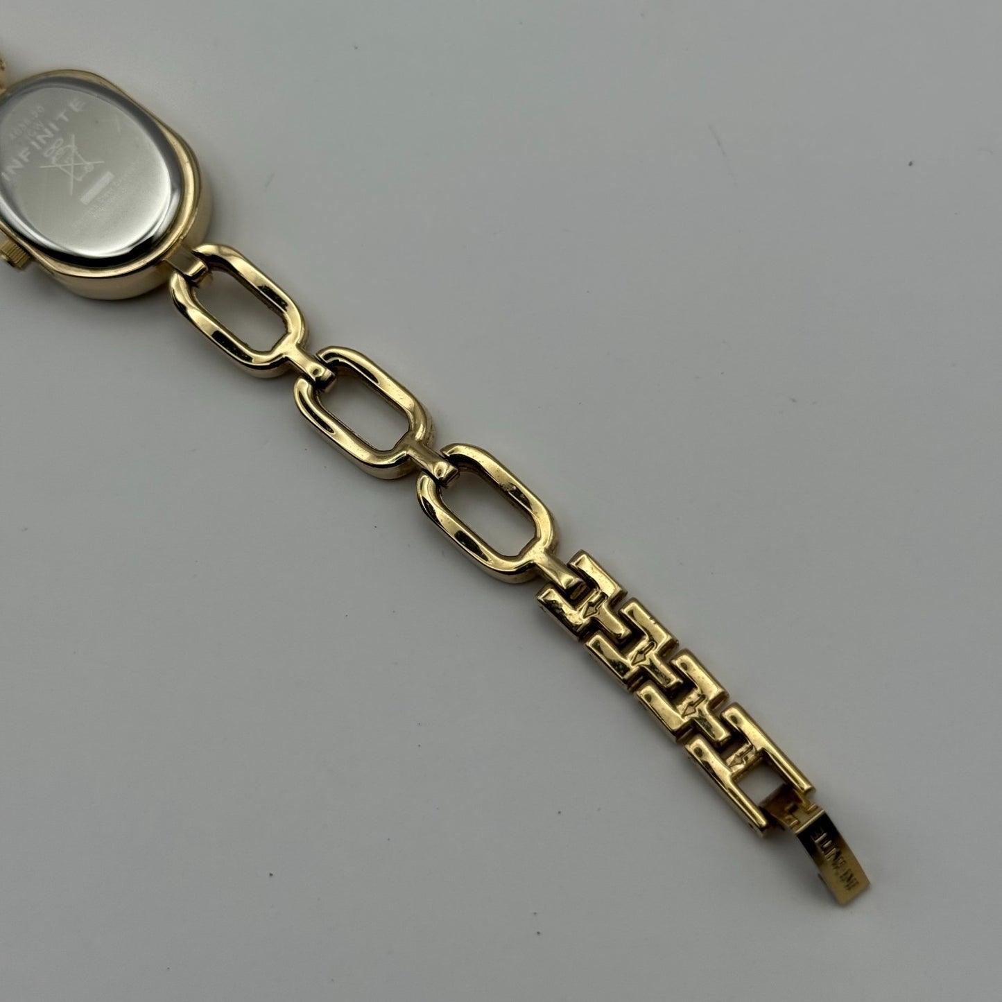 Infinite Ladies Quartz Watch Oval Dial Gold Tone Bracelet Japan Working 19mm