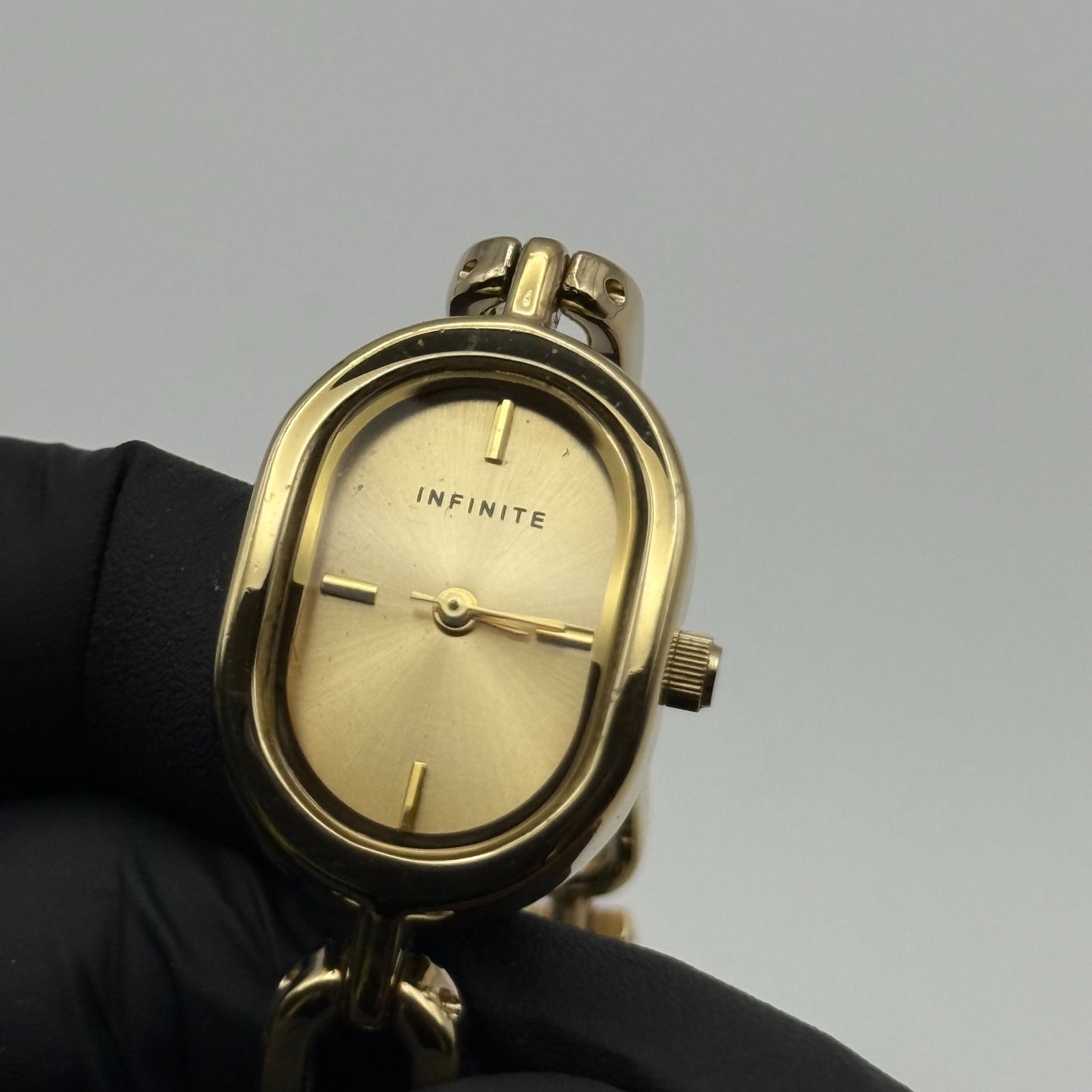 Infinite Ladies Quartz Watch Oval Dial Gold Tone Bracelet Japan Working 19mm