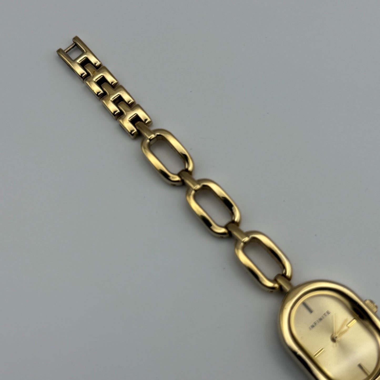 Infinite Ladies Quartz Watch Oval Dial Gold Tone Bracelet Japan Working 19mm