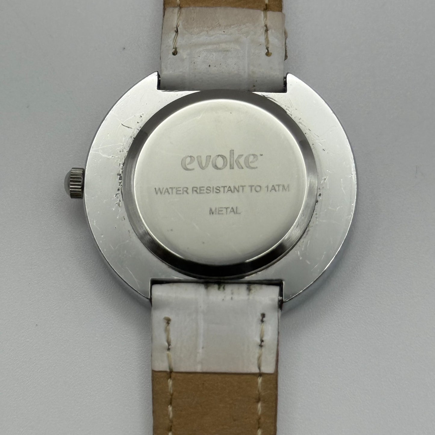 Evoke Ladies Quartz Watch Silver Dial Glitter Bezel White Strap Working 30mm