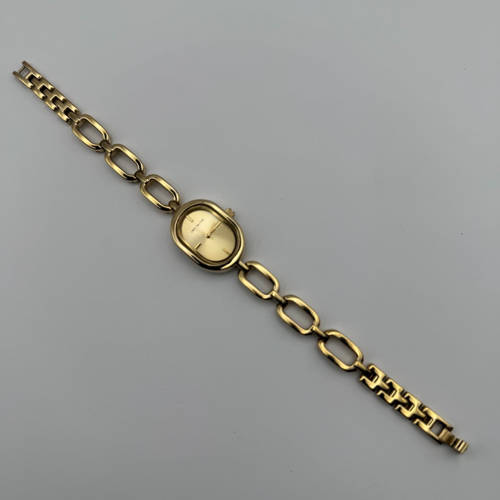 Infinite Ladies Quartz Watch Oval Dial Gold Tone Bracelet Japan Working 19mm