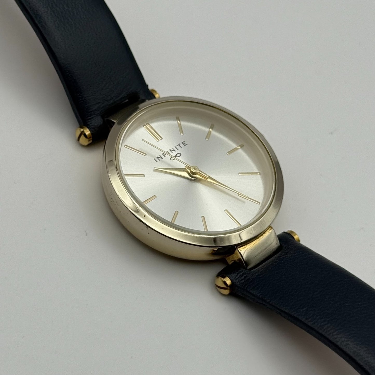 Infinite Ladies Quartz Watch Silver Dial Blue Leather Strap Japan Working 28mm