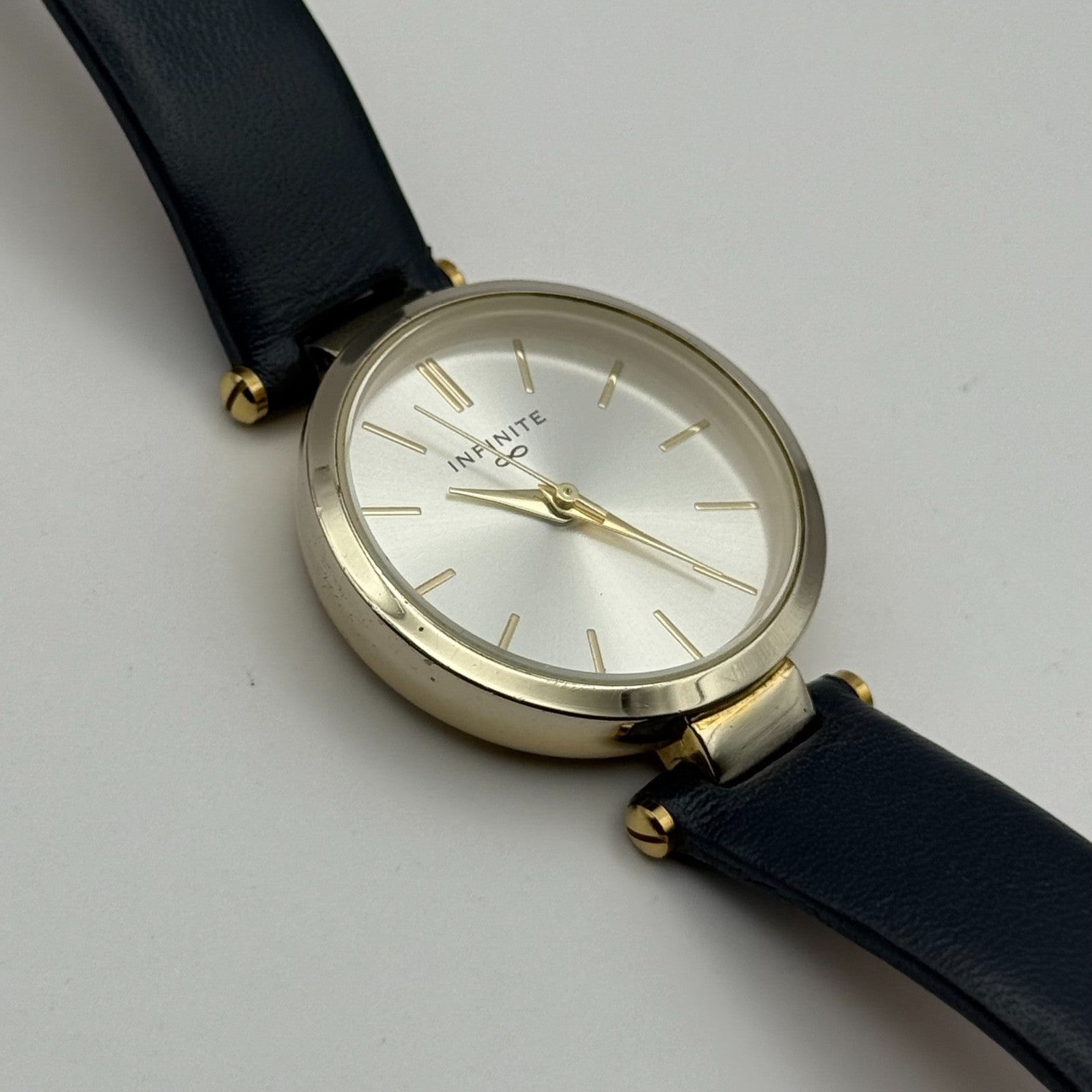 Infinite Ladies Quartz Watch Silver Dial Blue Leather Strap Japan Working 28mm