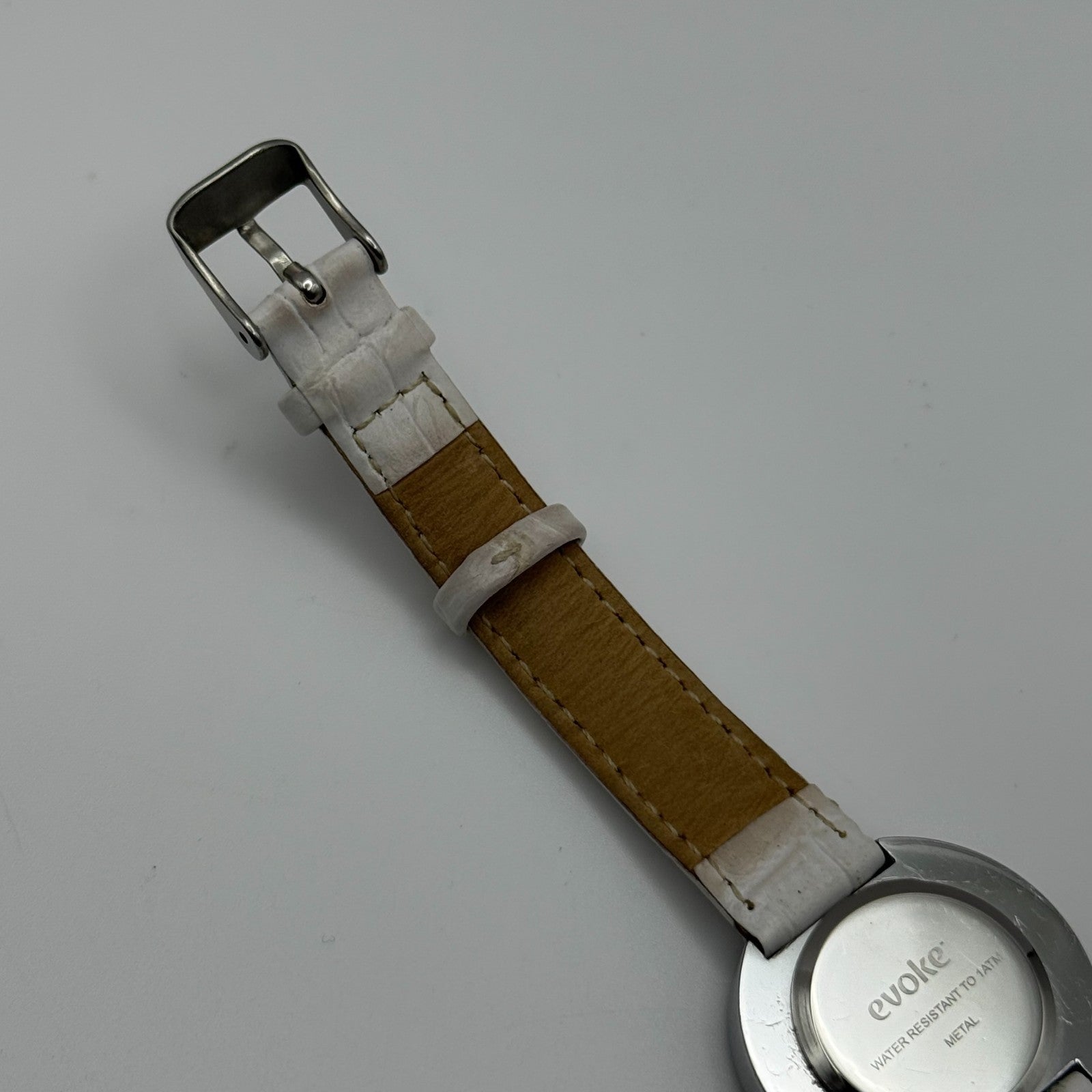 Evoke Ladies Quartz Watch Silver Dial Glitter Bezel White Strap Working 30mm