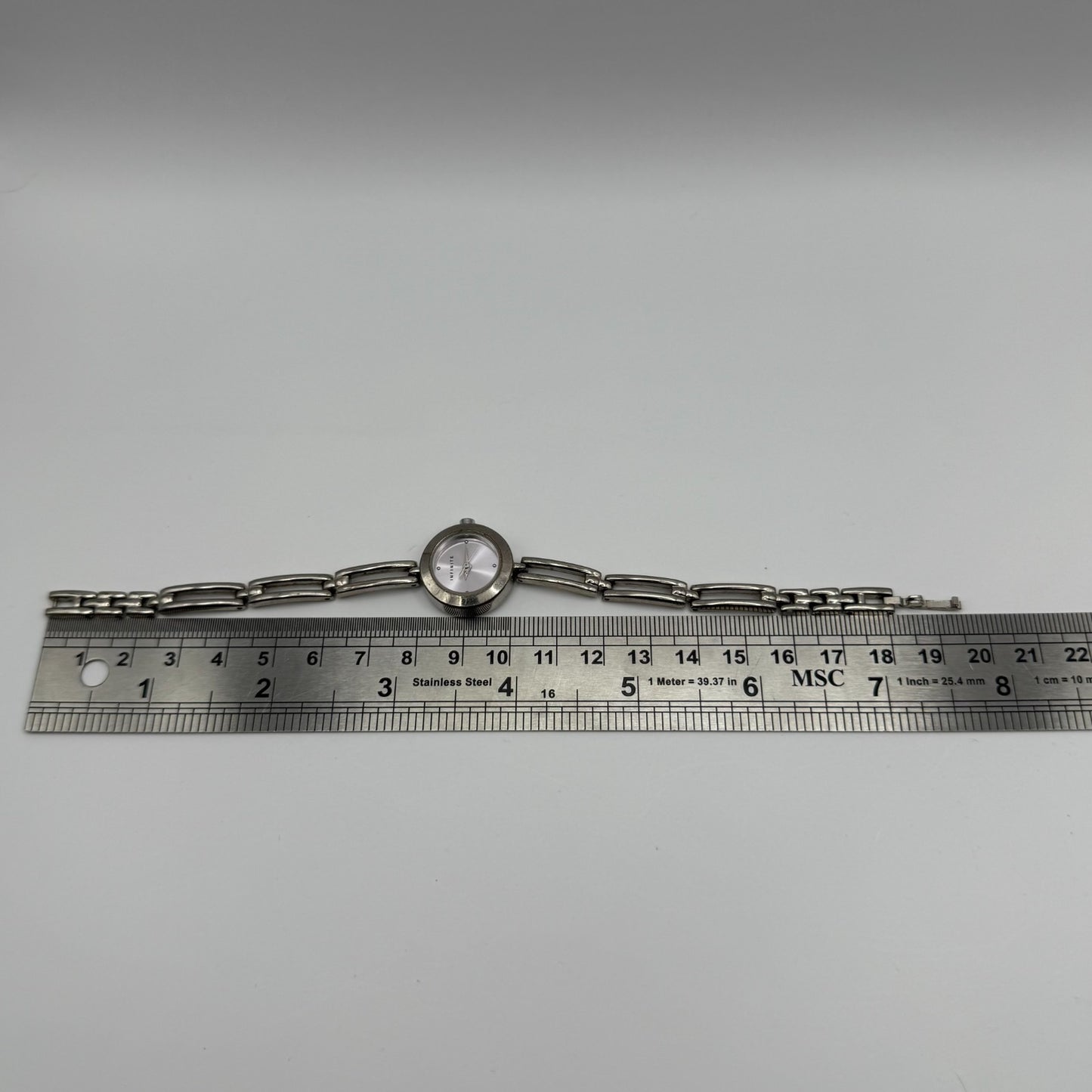 Infinite Ladies Quartz Watch Silver Tone Bracelet Japan Working 20mm 6.75 Inches