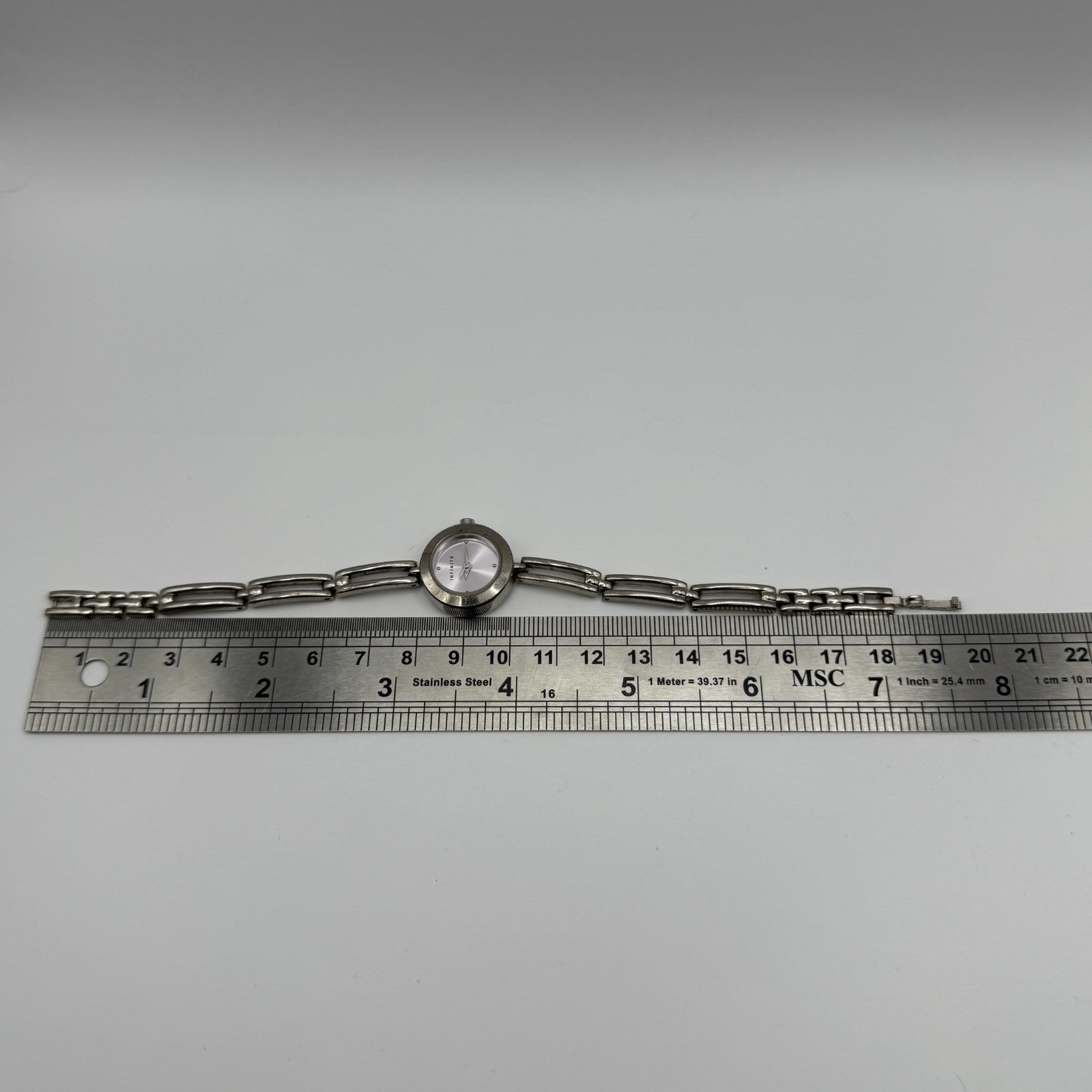 Infinite Ladies Quartz Watch Silver Tone Bracelet Japan Working 20mm 6.75 Inches