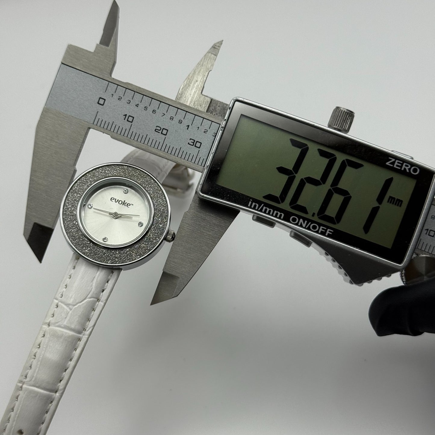 Evoke Ladies Quartz Watch Silver Dial Glitter Bezel White Strap Working 30mm