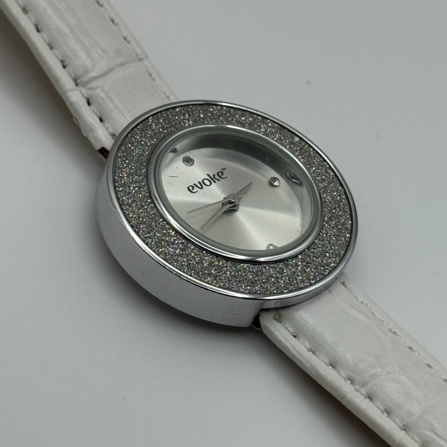 Evoke Ladies Quartz Watch Silver Dial Glitter Bezel White Strap Working 30mm
