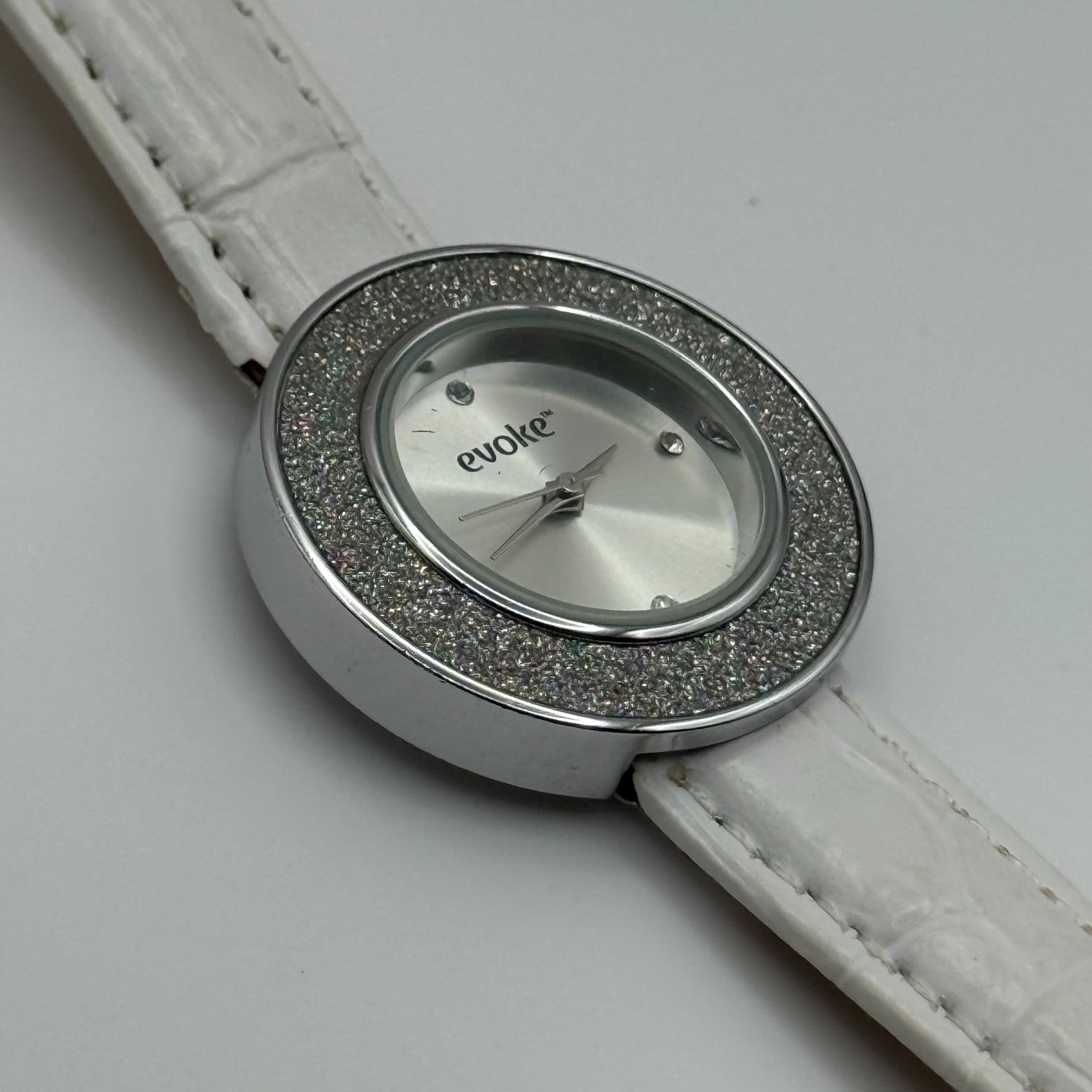 Evoke Ladies Quartz Watch Silver Dial Glitter Bezel White Strap Working 30mm