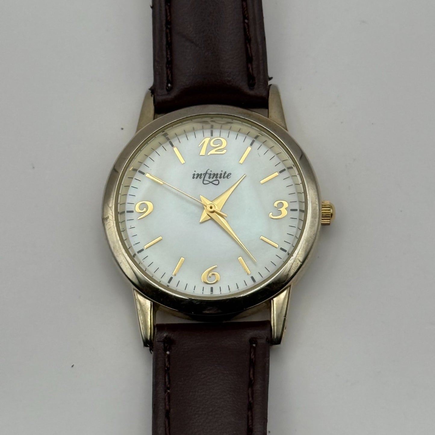 Infinite Ladies Quartz Watch Mother of Pearl Dial Brown Strap Japan Working 31mm