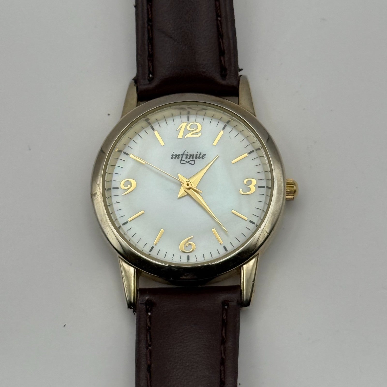 Infinite Ladies Quartz Watch Mother of Pearl Dial Brown Strap Japan Working 31mm