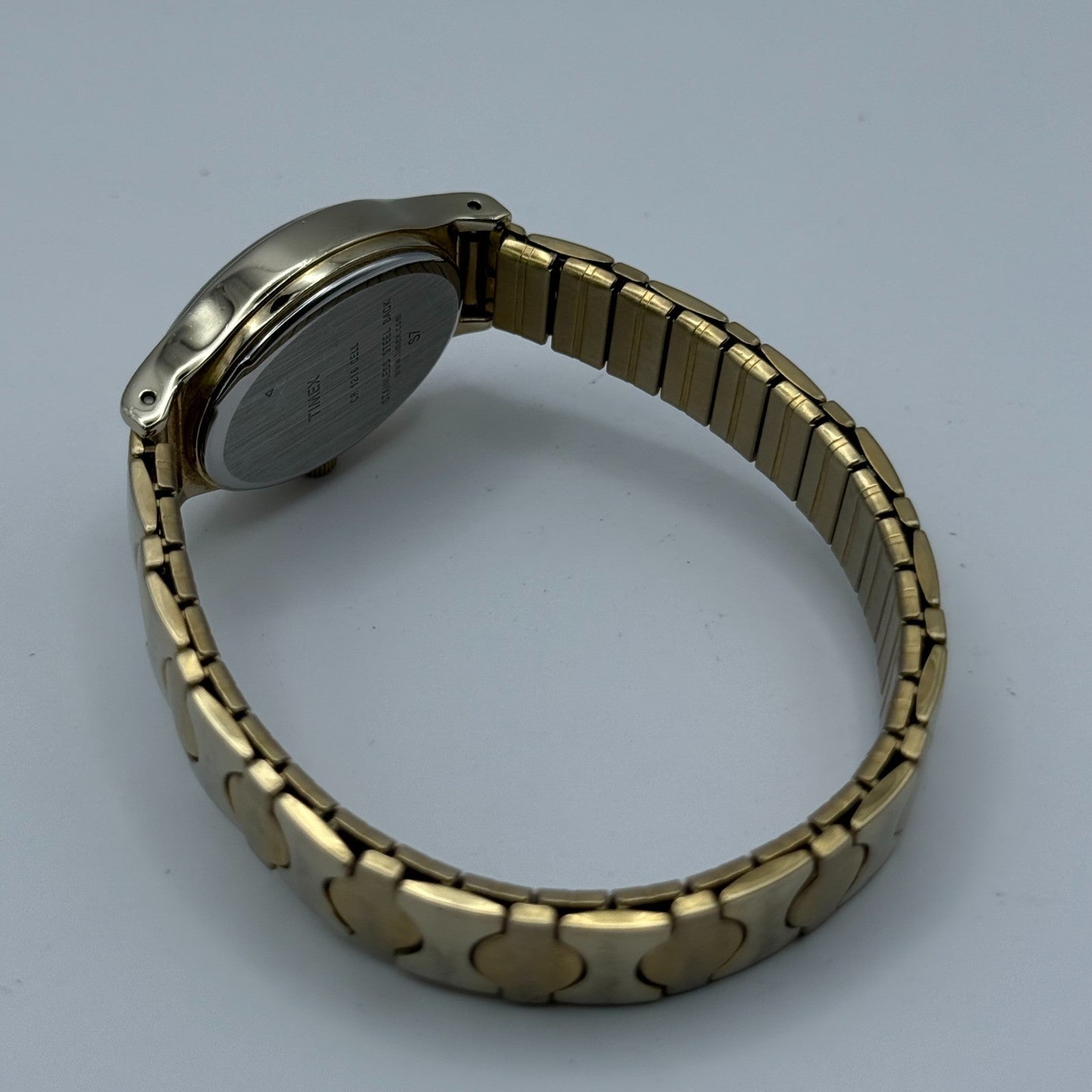 Timex Ladies Quartz Watch Oval Dial Gold Tone Stretch Band Steel Working 21mm