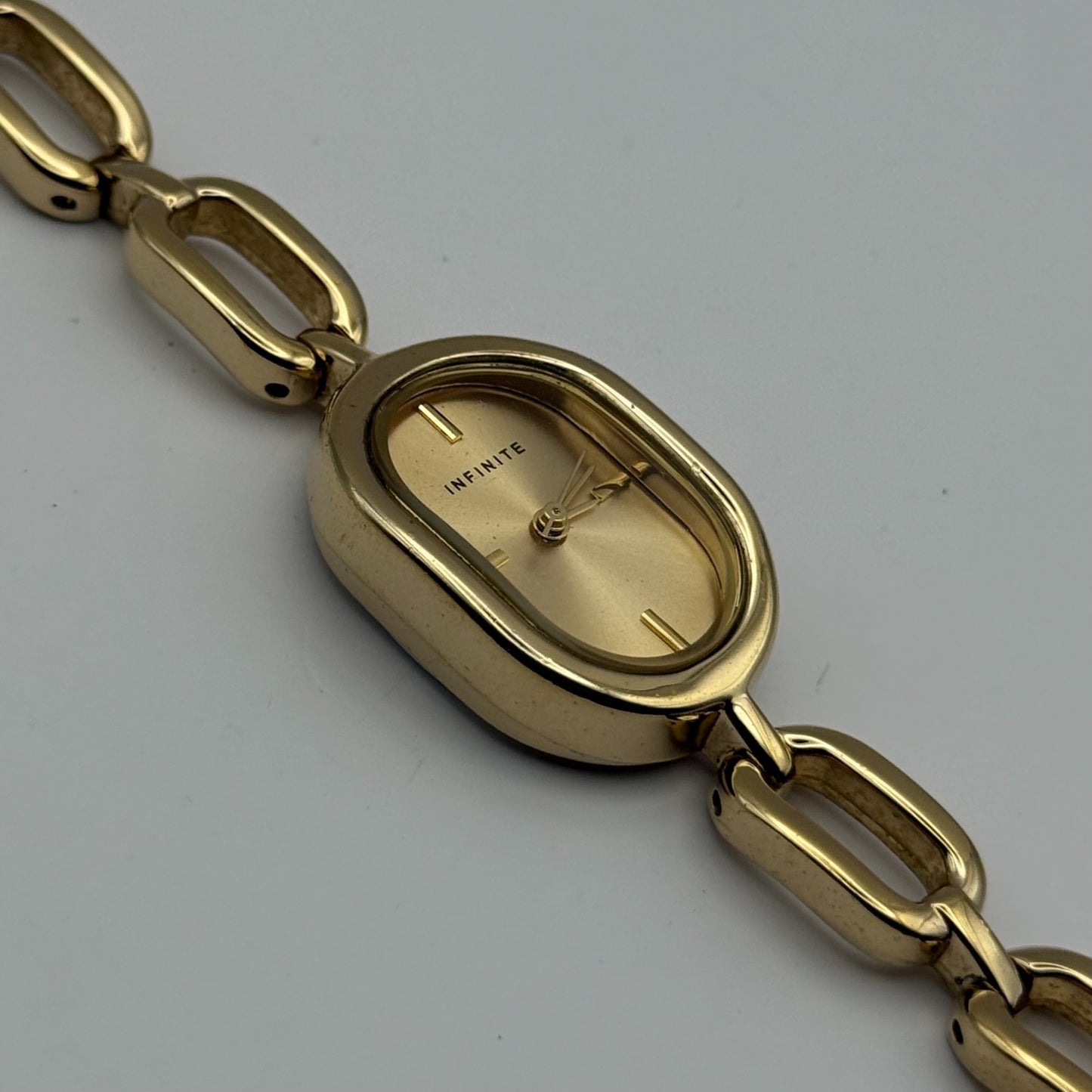 Infinite Ladies Quartz Watch Oval Dial Gold Tone Bracelet Japan Working 19mm