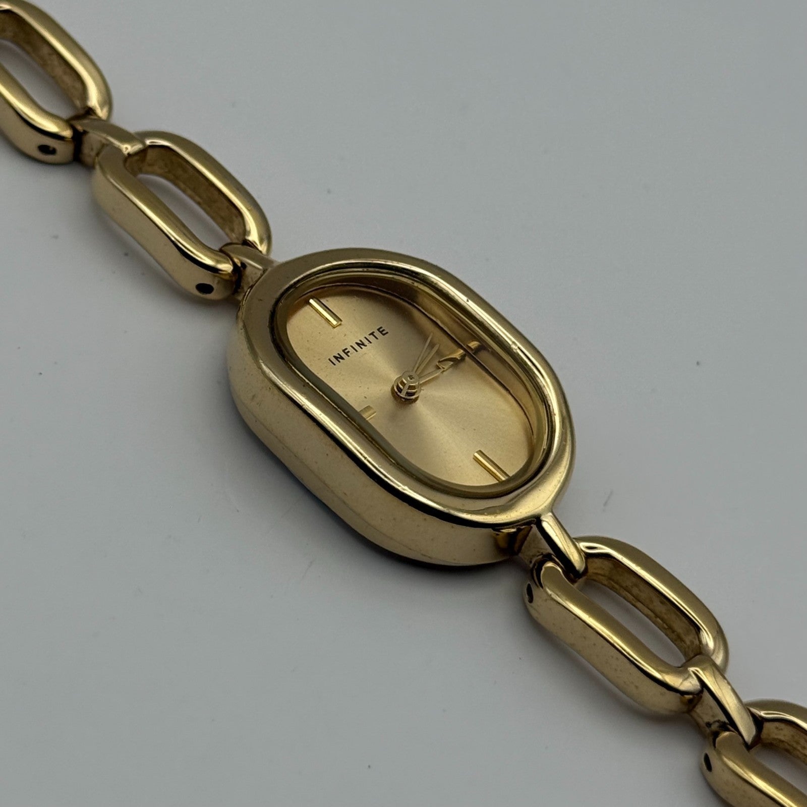 Infinite Ladies Quartz Watch Oval Dial Gold Tone Bracelet Japan Working 19mm