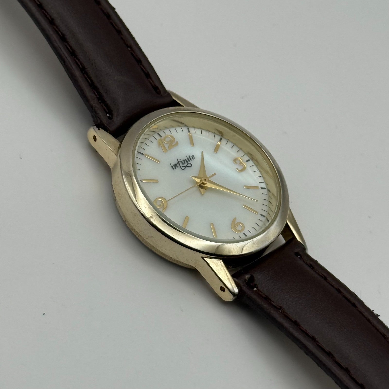 Infinite Ladies Quartz Watch Mother of Pearl Dial Brown Strap Japan Working 31mm