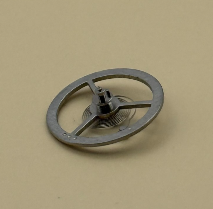 EB 1197 Balance Wheel Complete And Spring  10½’’’ 102 M Watch Movement Parts NOS