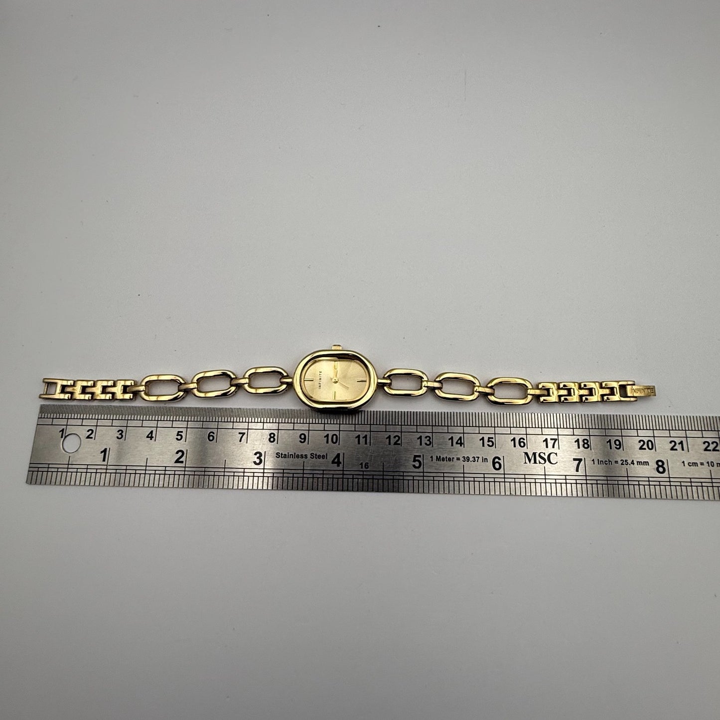 Infinite Ladies Quartz Watch Oval Dial Gold Tone Bracelet Japan Working 19mm