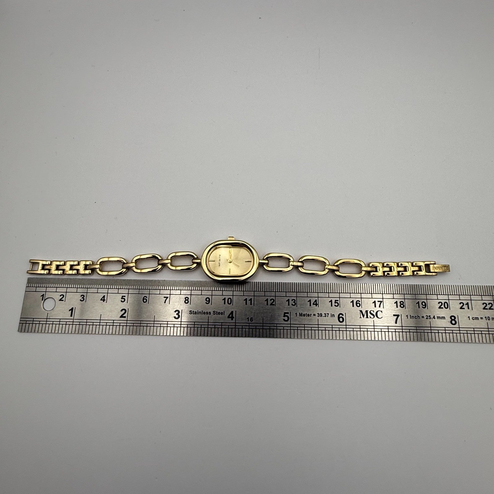 Infinite Ladies Quartz Watch Oval Dial Gold Tone Bracelet Japan Working 19mm