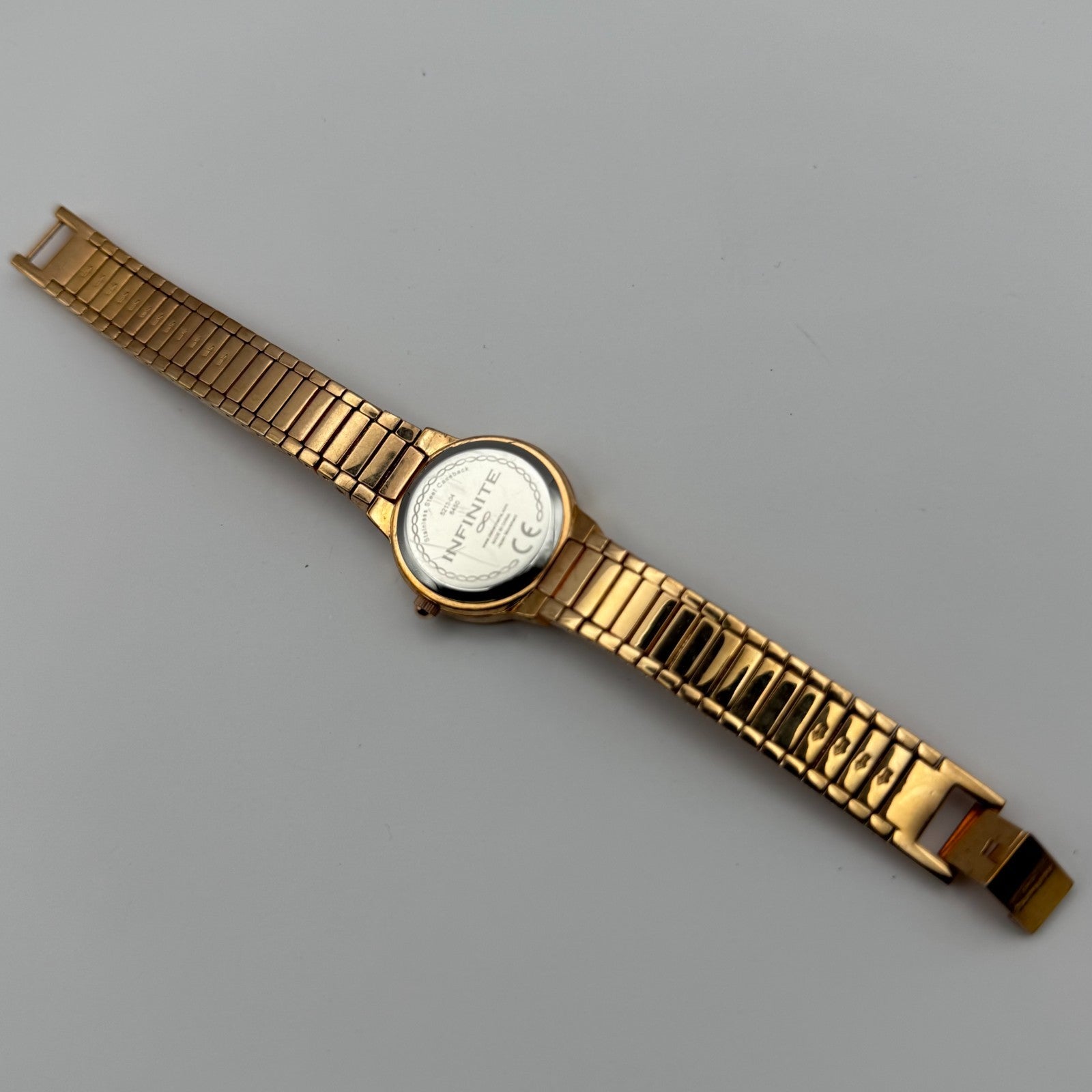 Infinite Ladies Quartz Watch Gold Tone Crystal Accents Bracelet Working 25mm