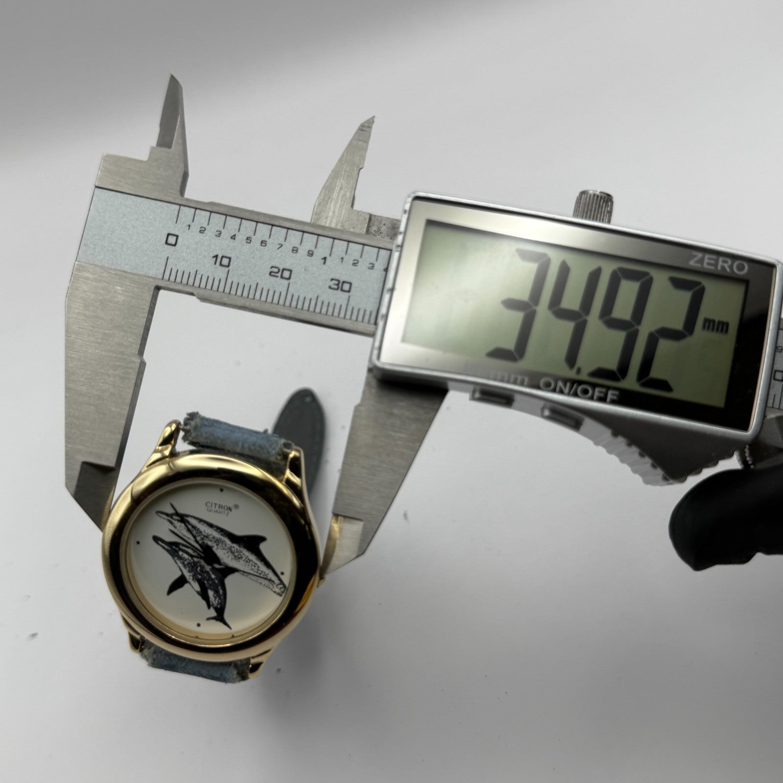 Citron Ladies Quartz Watch Dolphin Dial Gold Tone Blue Strap Working 35mm